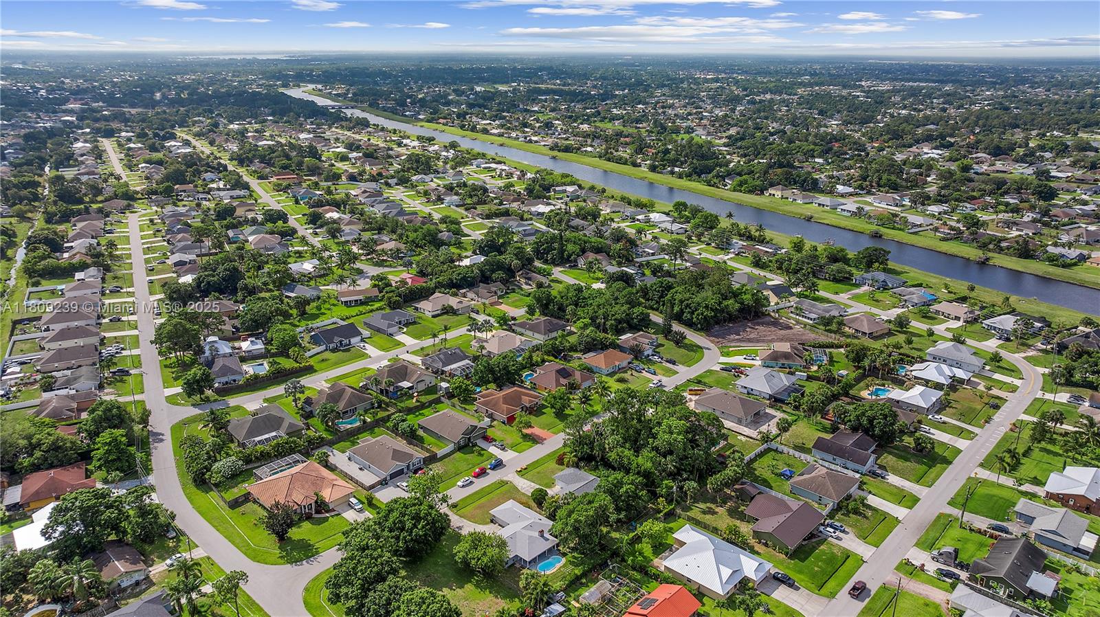 2330 Southwest Lejune Street Port St. Lucie, FL 34953 - Photo 18 of 20 an aerial view of residential houses with outdoor space