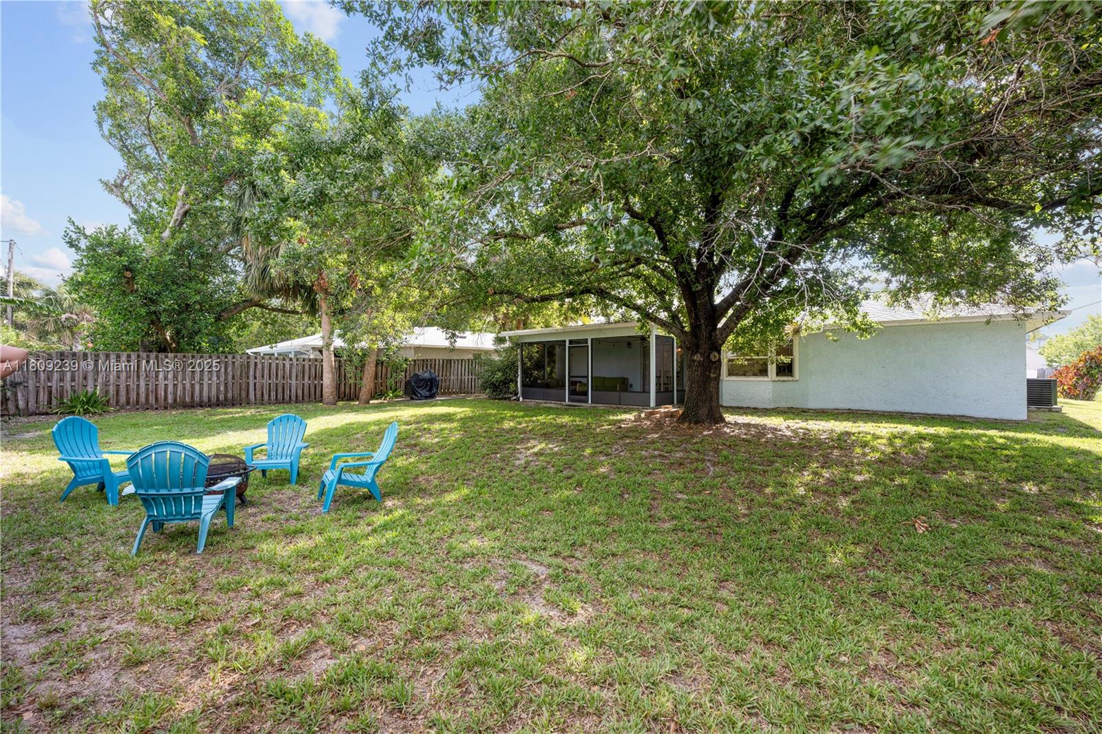 2330 Southwest Lejune Street Port St. Lucie, FL 34953 - Photo 19 of 20 a view of back yard with outdoor seating
