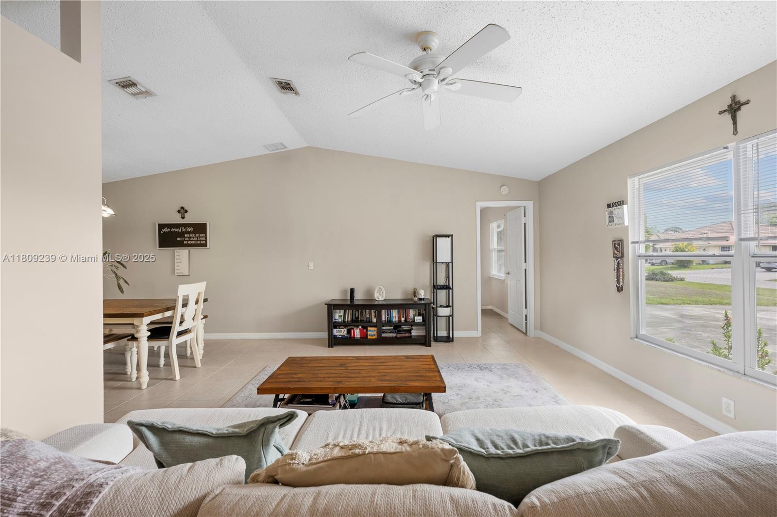 2330 Southwest Lejune Street Port St. Lucie, FL 34953 - Photo 5 of 20 a living room with furniture and a large window