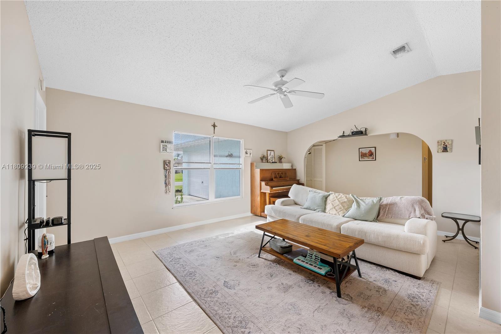 2330 Southwest Lejune Street Port St. Lucie, FL 34953 - Photo 7 of 20 a living room with furniture and wooden floor