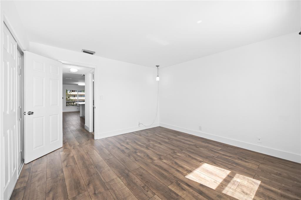 1100 Crystal Lake Drive, Unit 209 Deerfield Beach, FL 33073 - Photo 19 of 34 a view of an empty room and window