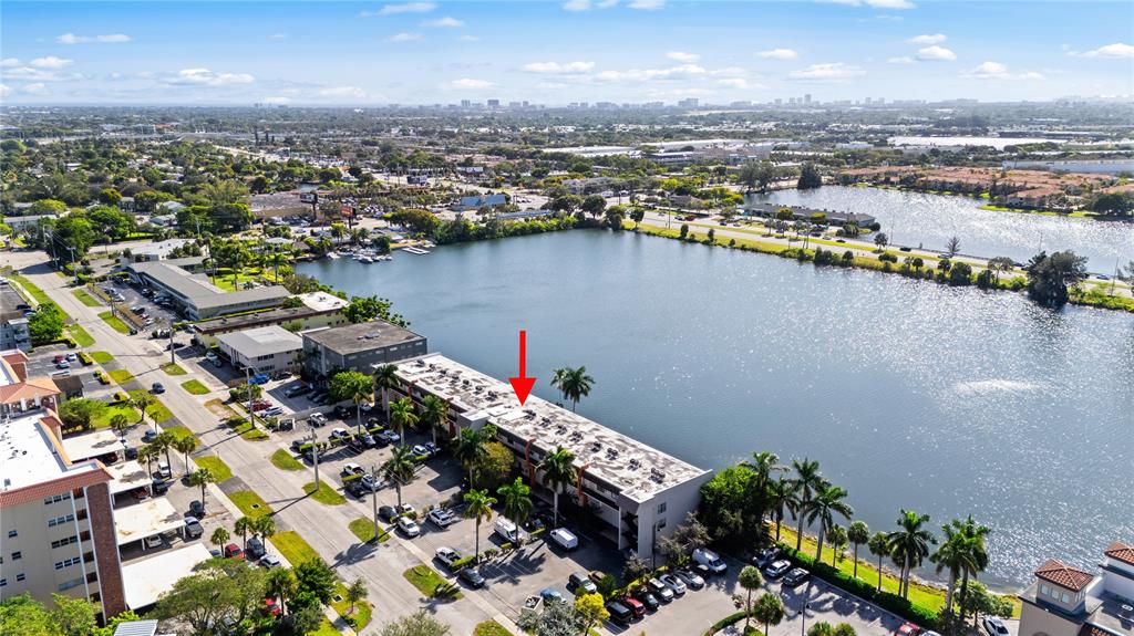 1100 Crystal Lake Drive, Unit 209 Deerfield Beach, FL 33073 - Photo 26 of 34 an aerial view of a city with lots of residential buildings ocean and mountain view in back