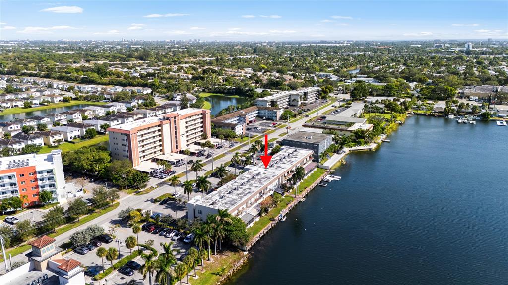 1100 Crystal Lake Drive, Unit 209 Deerfield Beach, FL 33073 - Photo 27 of 34 an aerial view of city and lake