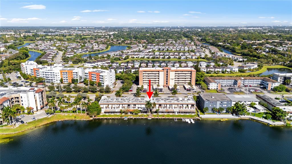 1100 Crystal Lake Drive, Unit 209 Deerfield Beach, FL 33073 - Photo 28 of 34 an aerial view of residential building with parking space and ocean view