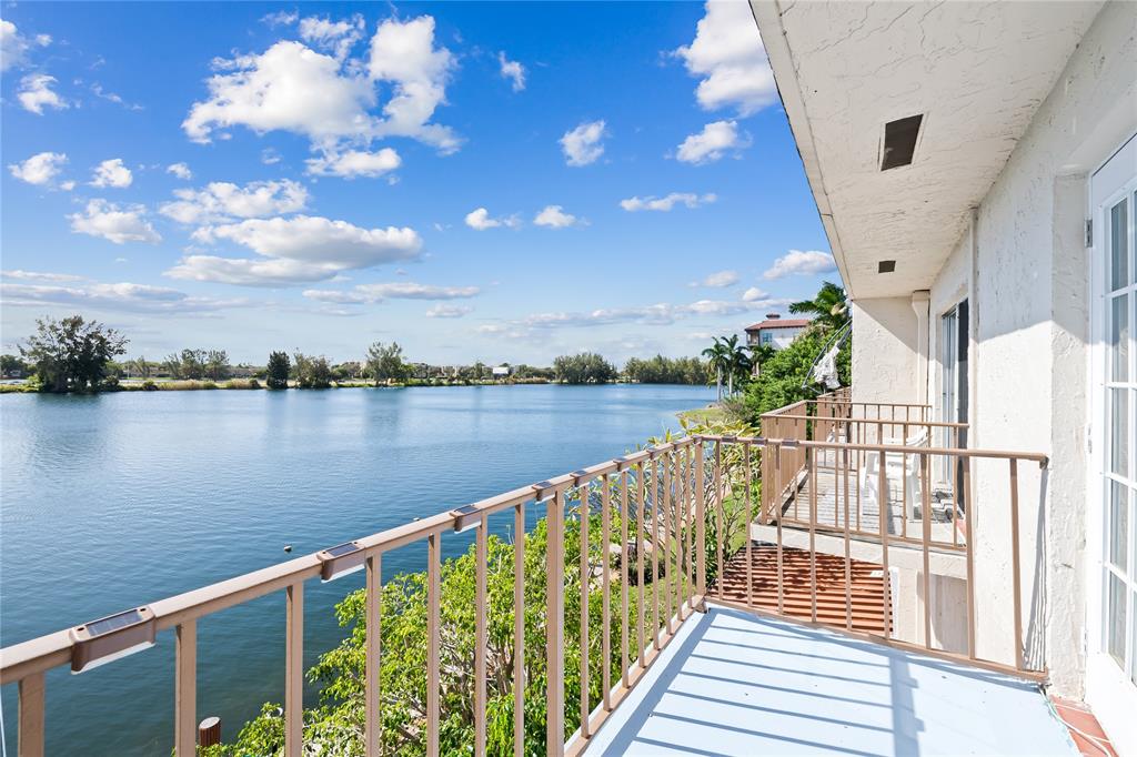 1100 Crystal Lake Drive, Unit 209 Deerfield Beach, FL 33073 - Photo 6 of 34 a view of a lake from a balcony