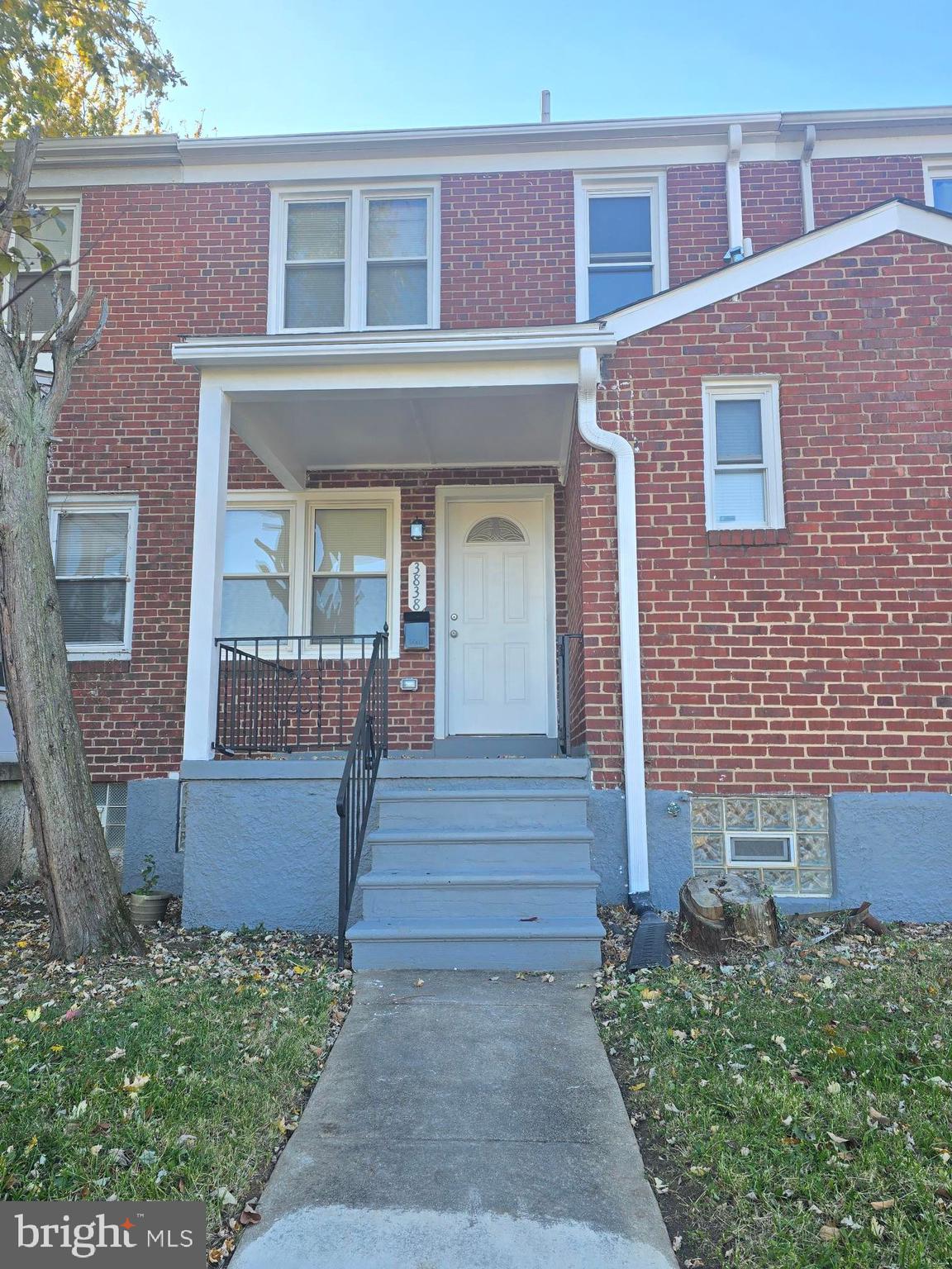 3838 Greenspring Avenue Baltimore, MD 21211 - Photo 2 of 23 front view of a house with a porch