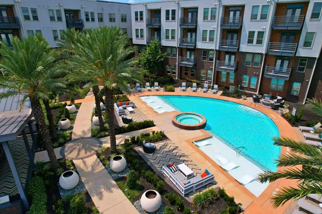 an aerial view of multiple houses with yard