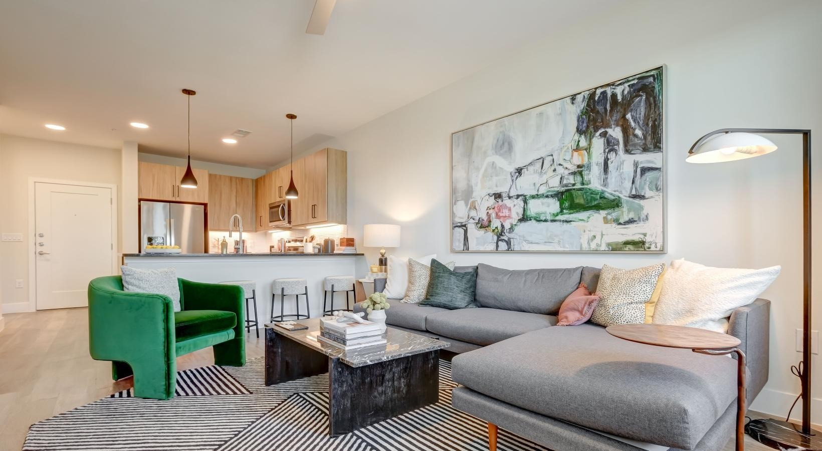 23233 Western Centre Drive, Unit A1 60 Katy, TX 77494 - Photo 9 of 15 a living room with furniture and a wooden floor