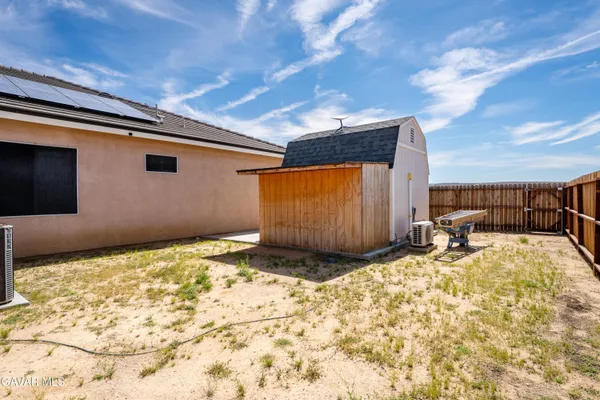a view of a backyard of a house