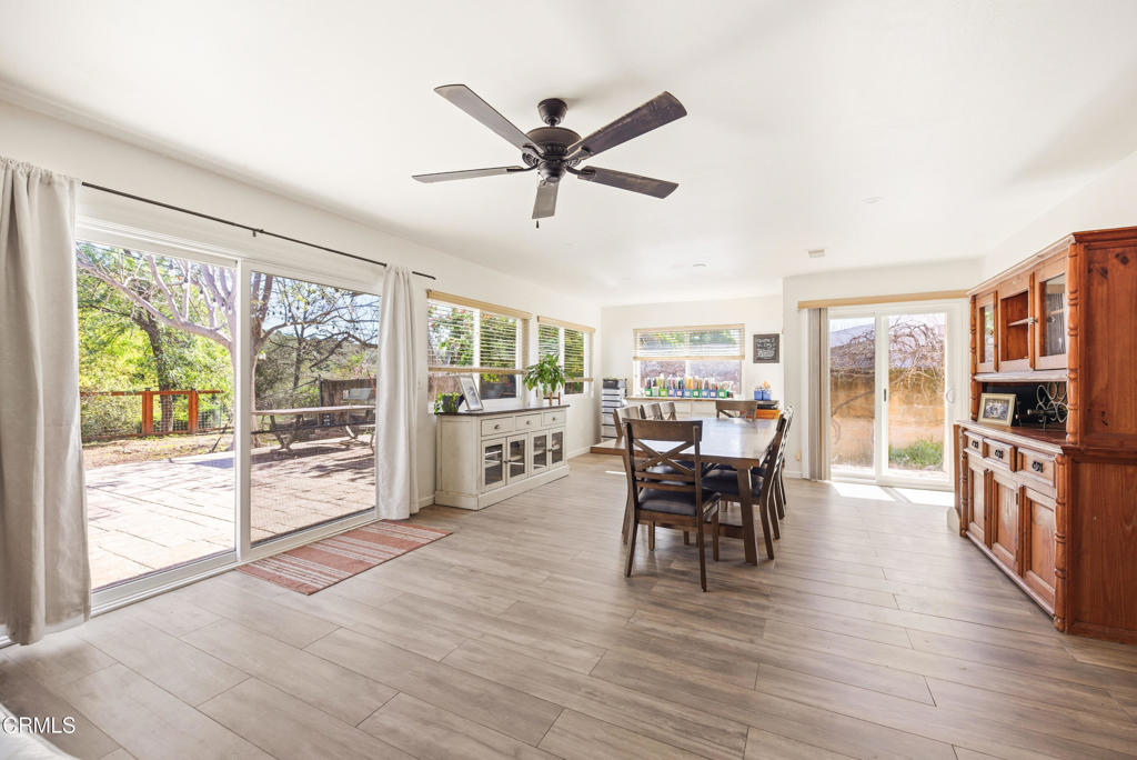 616 Island View Street Fillmore, CA 93015 - Photo 17 of 57 a dining room with furniture a chandelier and wooden floor
