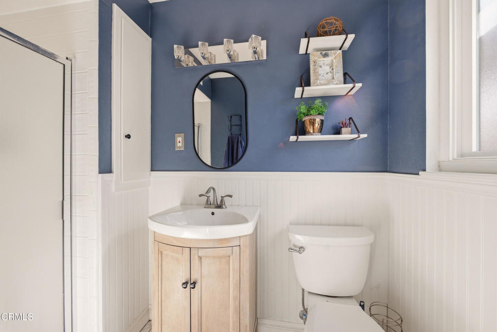 616 Island View Street Fillmore, CA 93015 - Photo 24 of 57 a bathroom with a toilet sink and mirror