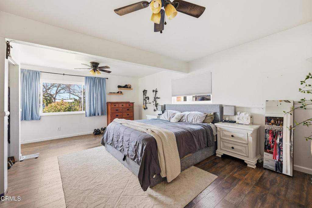 616 Island View Street Fillmore, CA 93015 - Photo 28 of 57 a spacious bedroom with a bed and a chandelier