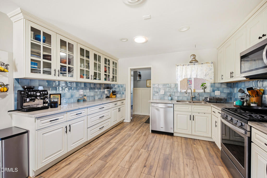 616 Island View Street Fillmore, CA 93015 - Photo 8 of 57 a kitchen with a sink wooden floor and stainless steel appliances