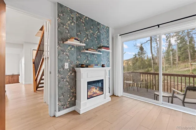 a view of a livingroom with furniture and a fireplace