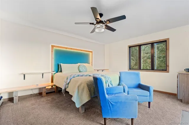 a bed room with furniture and a window