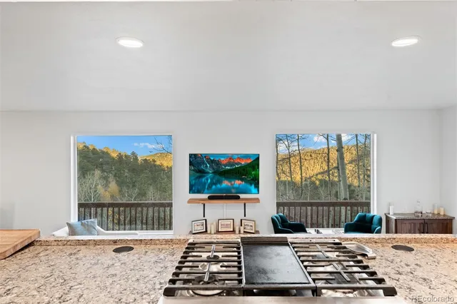 a room with window and flat screen tv