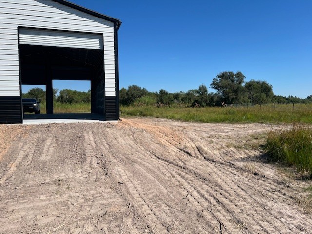 22099 Sattler Road Winnie, TX 77665 - Photo 8 of 20 a view of a pathway both side of a building