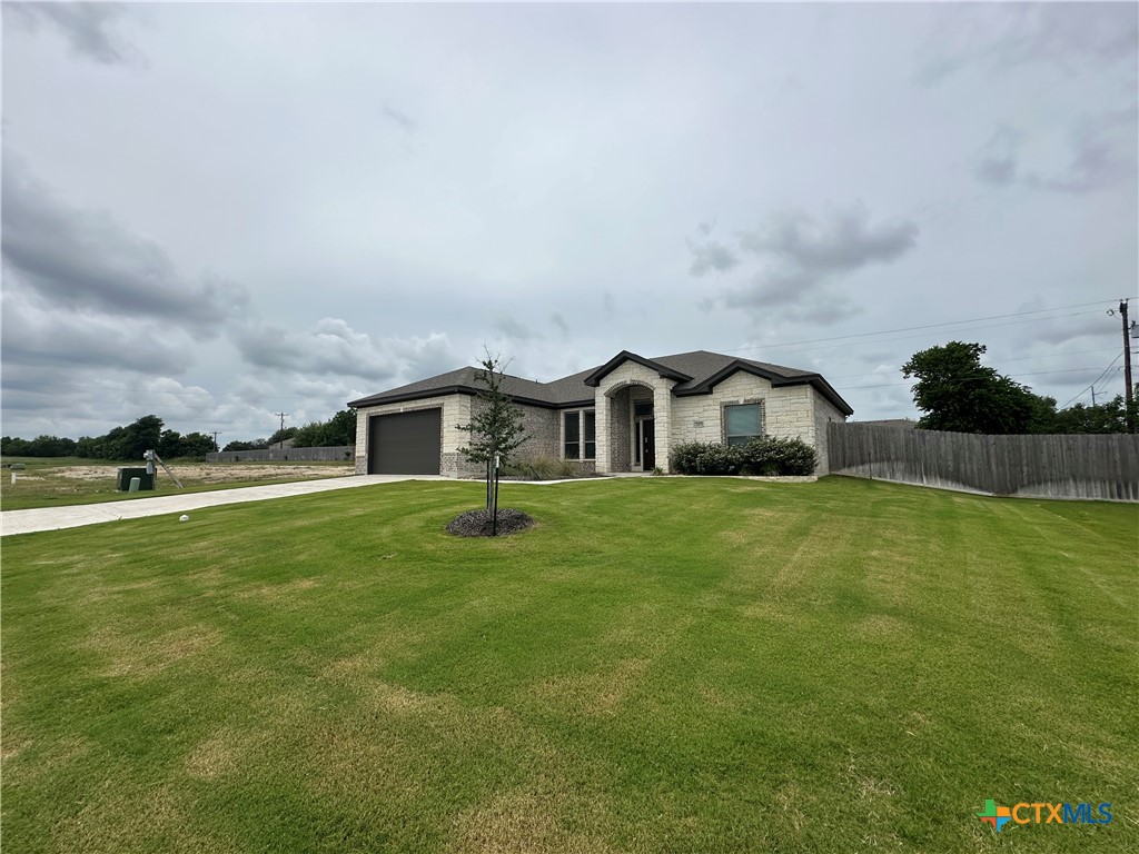 203 Lasso Loop Lorena, TX 76655 - Photo 1 of 37 a front view of house with yard and fence