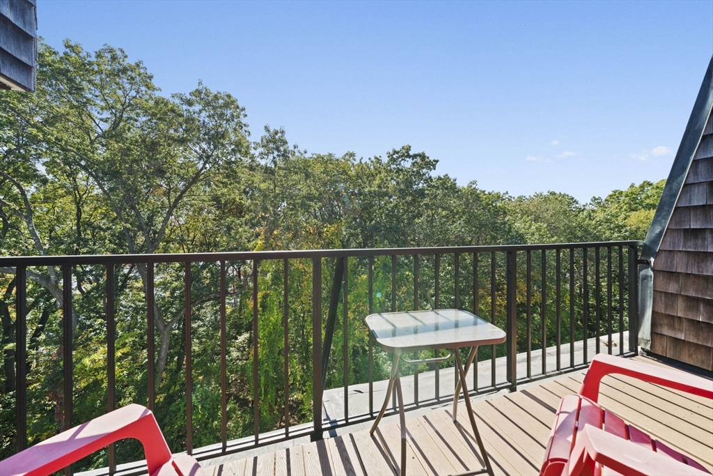 9 Broadway, Unit 305 Saugus, MA 01906 - Photo 15 of 32 a balcony with a potted plant on a deck