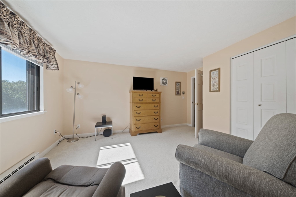 9 Broadway, Unit 305 Saugus, MA 01906 - Photo 22 of 32 a living room with furniture