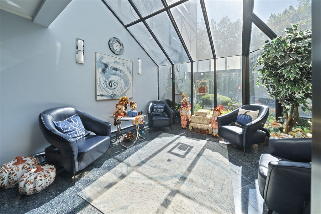 9 Broadway, Unit 305 Saugus, MA 01906 - Photo 24 of 32 a living room with furniture and a large window