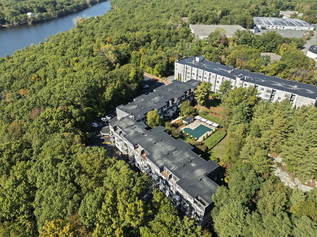 9 Broadway, Unit 305 Saugus, MA 01906 - Photo 26 of 32 an aerial view of a house with a yard lake and outdoor seating