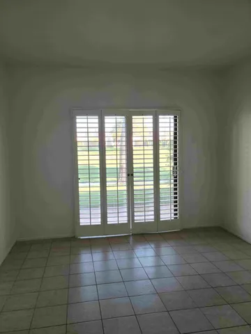 an empty room with a bathroom