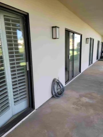 a view of a door and a window