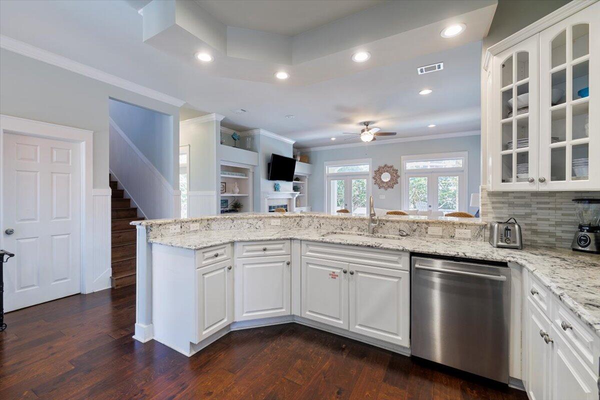 3581 Waverly Circle Destin, FL 32541 - Photo 11 of 33 a large kitchen with granite countertop a sink and stove top oven