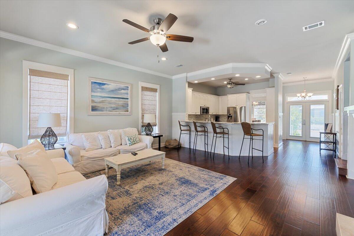 3581 Waverly Circle Destin, FL 32541 - Photo 13 of 33 a living room with furniture wooden floor and a large window