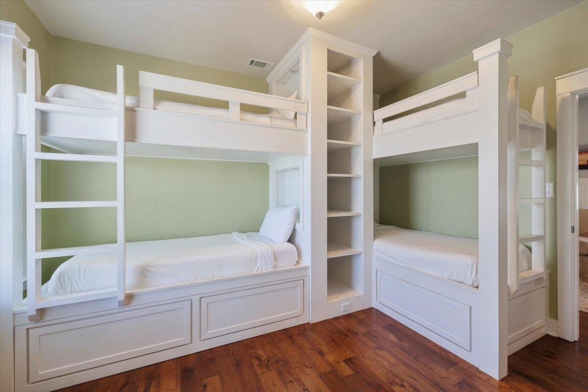 3581 Waverly Circle Destin, FL 32541 - Photo 20 of 33 a view of bedroom with furniture and wooden floor