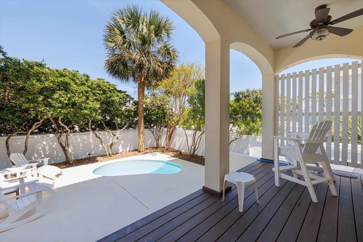 3581 Waverly Circle Destin, FL 32541 - Photo 29 of 33 a view of a chairs and table on the wooden floor