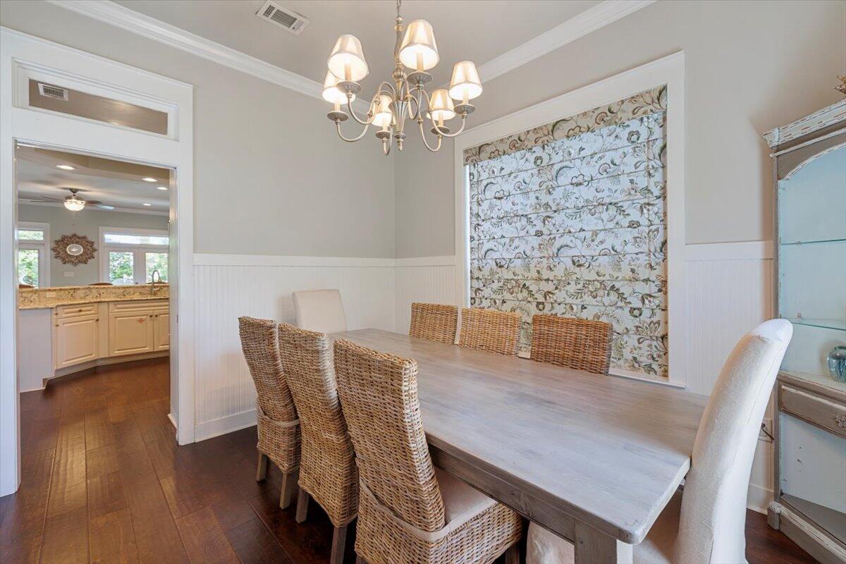 3581 Waverly Circle Destin, FL 32541 - Photo 5 of 33 a view of a dining room with furniture and wooden floor