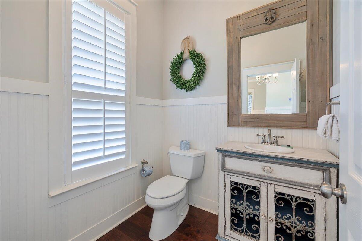 3581 Waverly Circle Destin, FL 32541 - Photo 7 of 33 a bathroom with a toilet sink and mirror