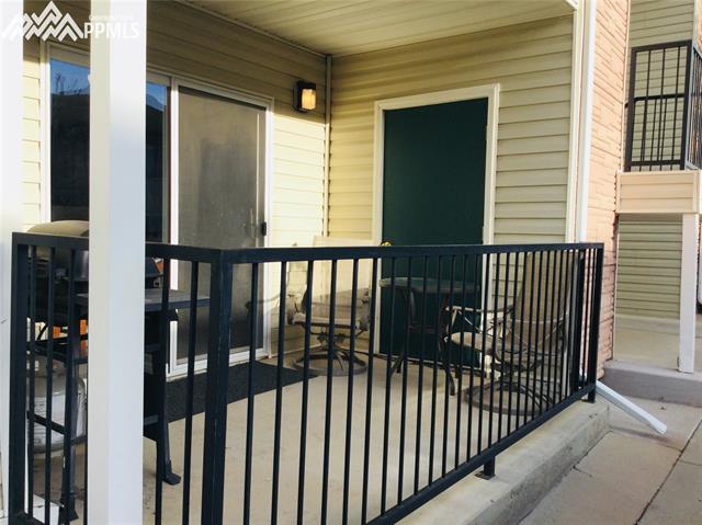 2095 Legacy Ridge View, Unit 112 Colorado Springs, CO 80910 - Photo 3 of 28 Patio to the unit, storage area. Patio is off the living room.