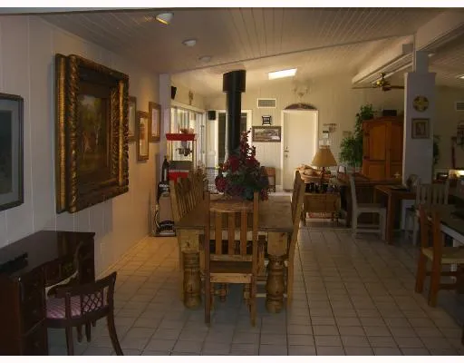 a living room with furniture and a lamp