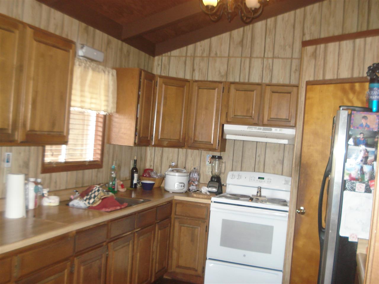 70 Alae Road Kula, HI 96790 - Photo 7 of 24 a kitchen with a sink cabinets and window
