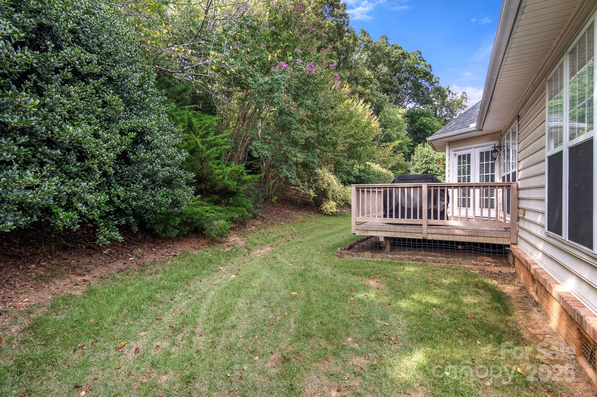 191 Melbourne Drive Fort Mill, SC 29708 - Photo 12 of 35 a view of a yard with porch and wooden fence