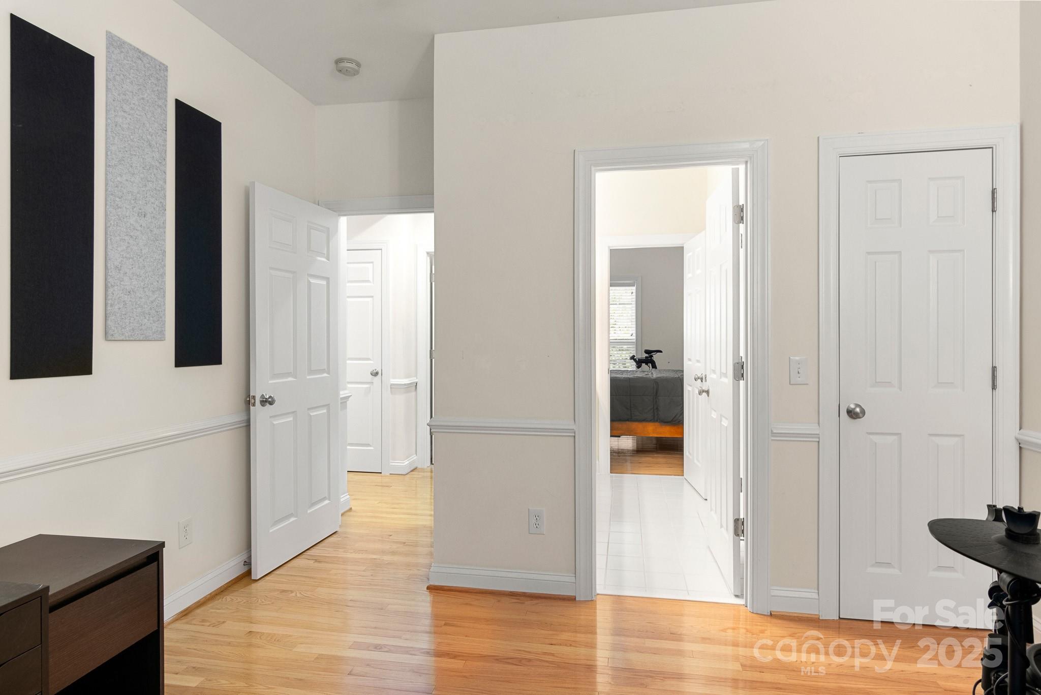191 Melbourne Drive Fort Mill, SC 29708 - Photo 16 of 35 a view of a hallway with wooden floor and staircase