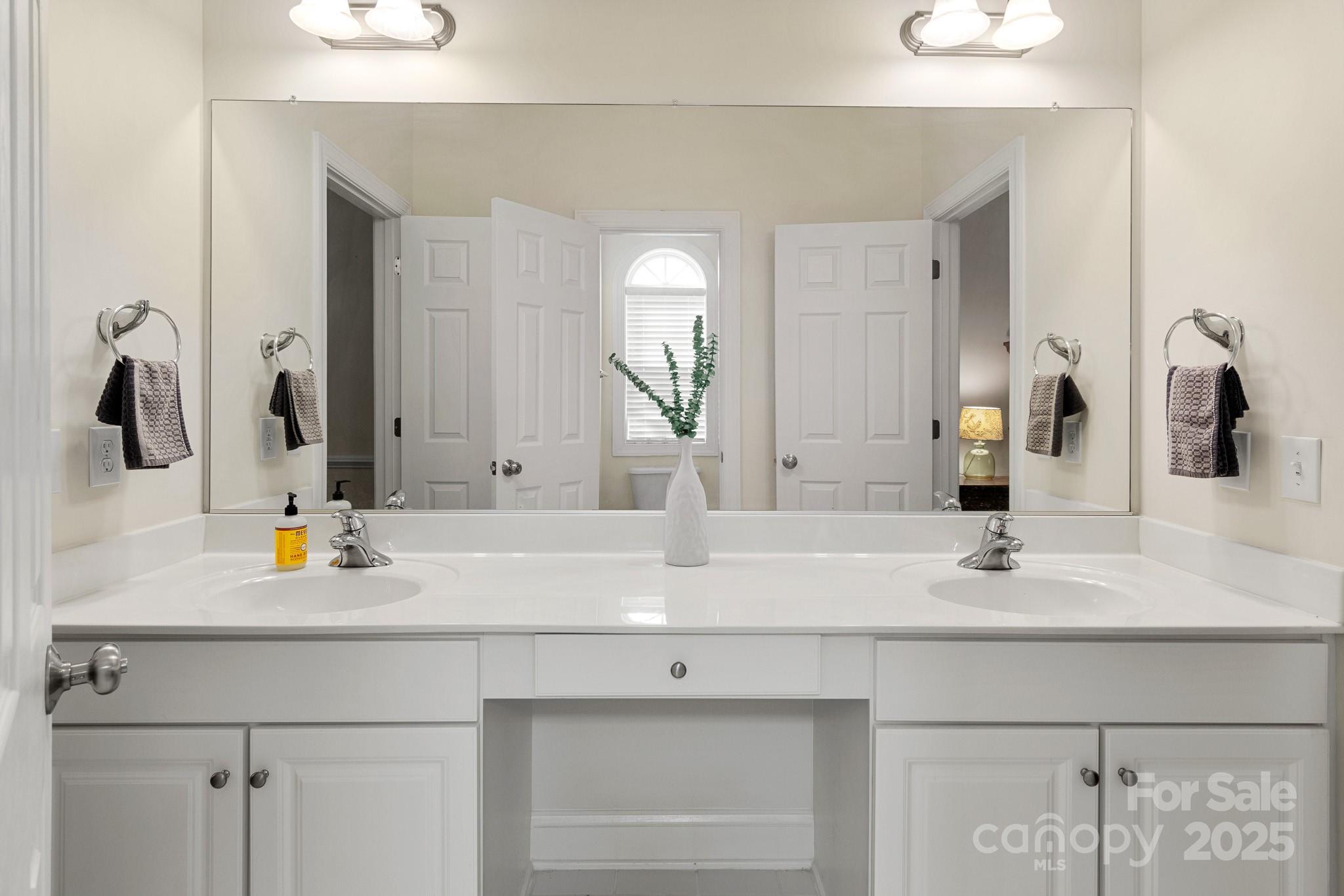 191 Melbourne Drive Fort Mill, SC 29708 - Photo 17 of 35 a bathroom with double vanity sink and a mirror