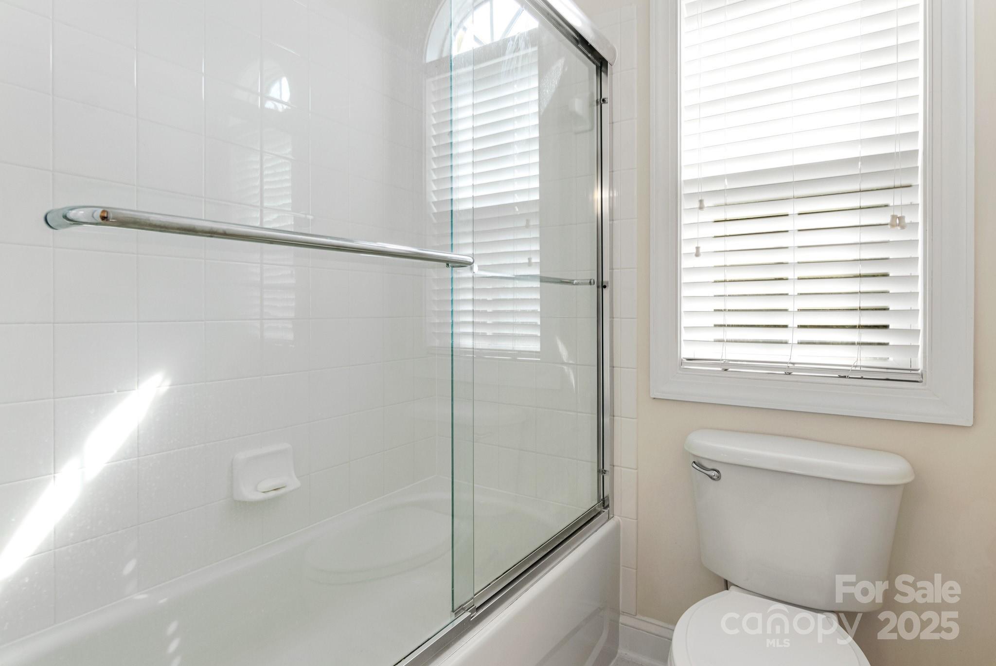 191 Melbourne Drive Fort Mill, SC 29708 - Photo 18 of 35 a bathroom with a toilet and a shower