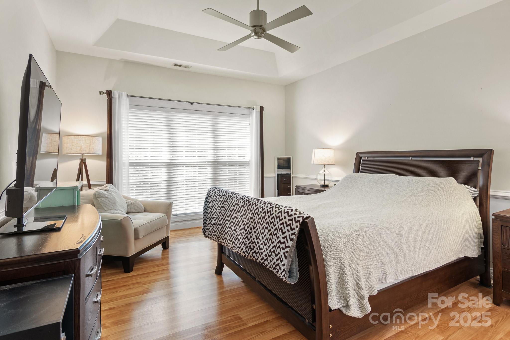 191 Melbourne Drive Fort Mill, SC 29708 - Photo 20 of 35 a bedroom with a bed a couch and a large window