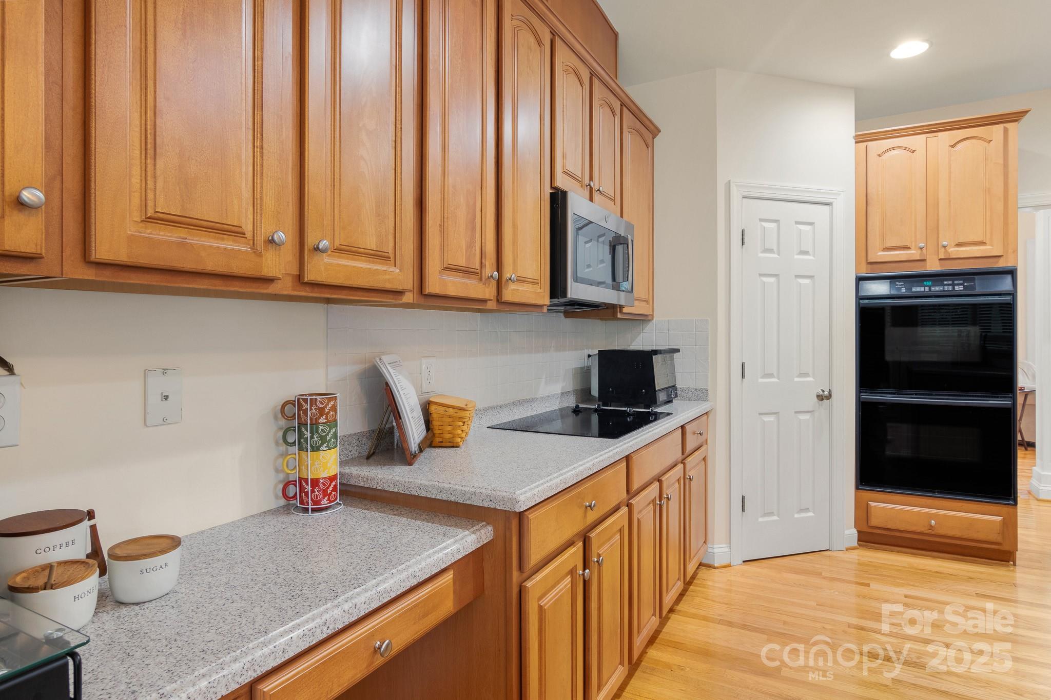 191 Melbourne Drive Fort Mill, SC 29708 - Photo 31 of 35 a kitchen with stainless steel appliances granite countertop a sink stove and cabinets
