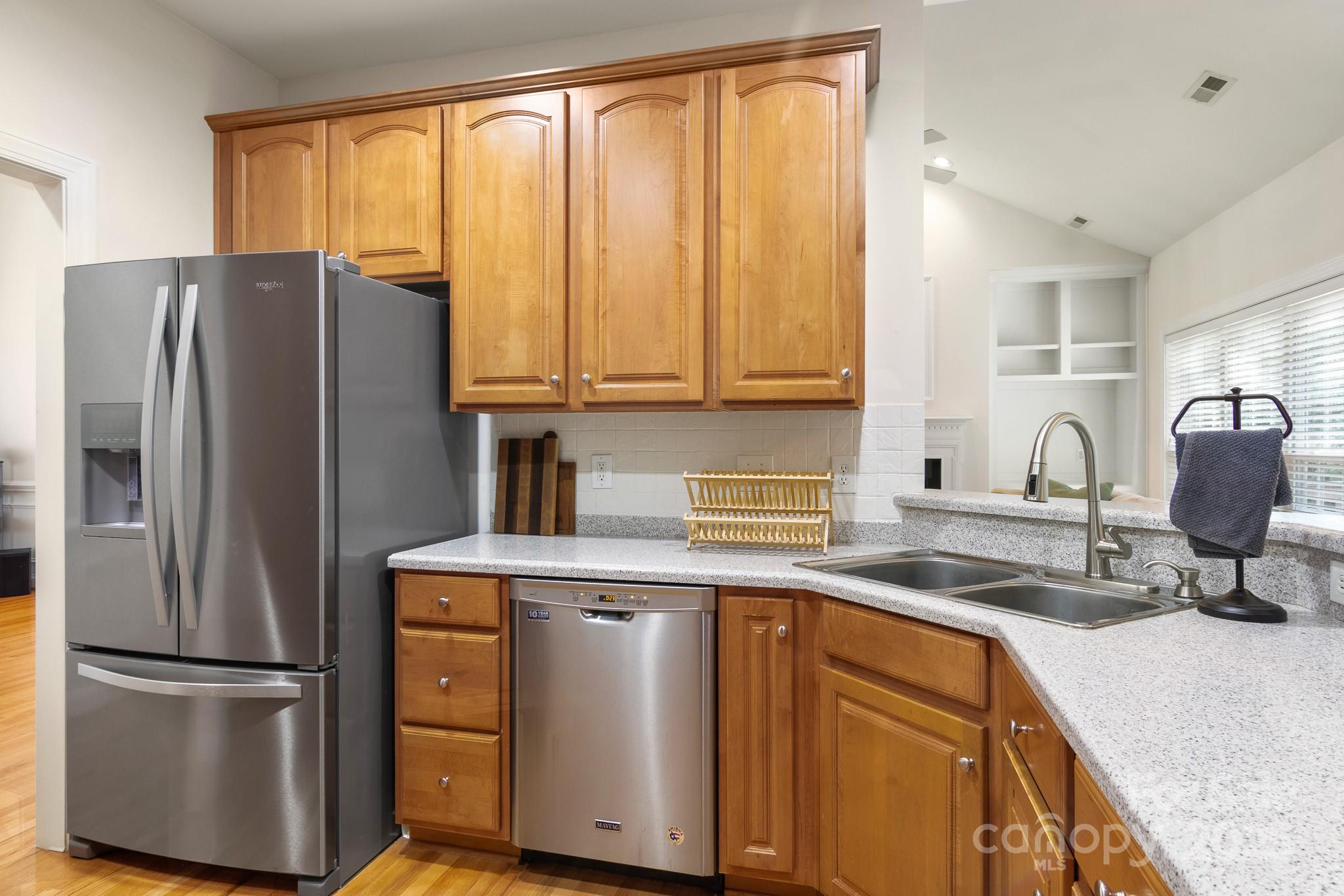 191 Melbourne Drive Fort Mill, SC 29708 - Photo 32 of 35 a kitchen with stainless steel appliances granite countertop a refrigerator and a sink