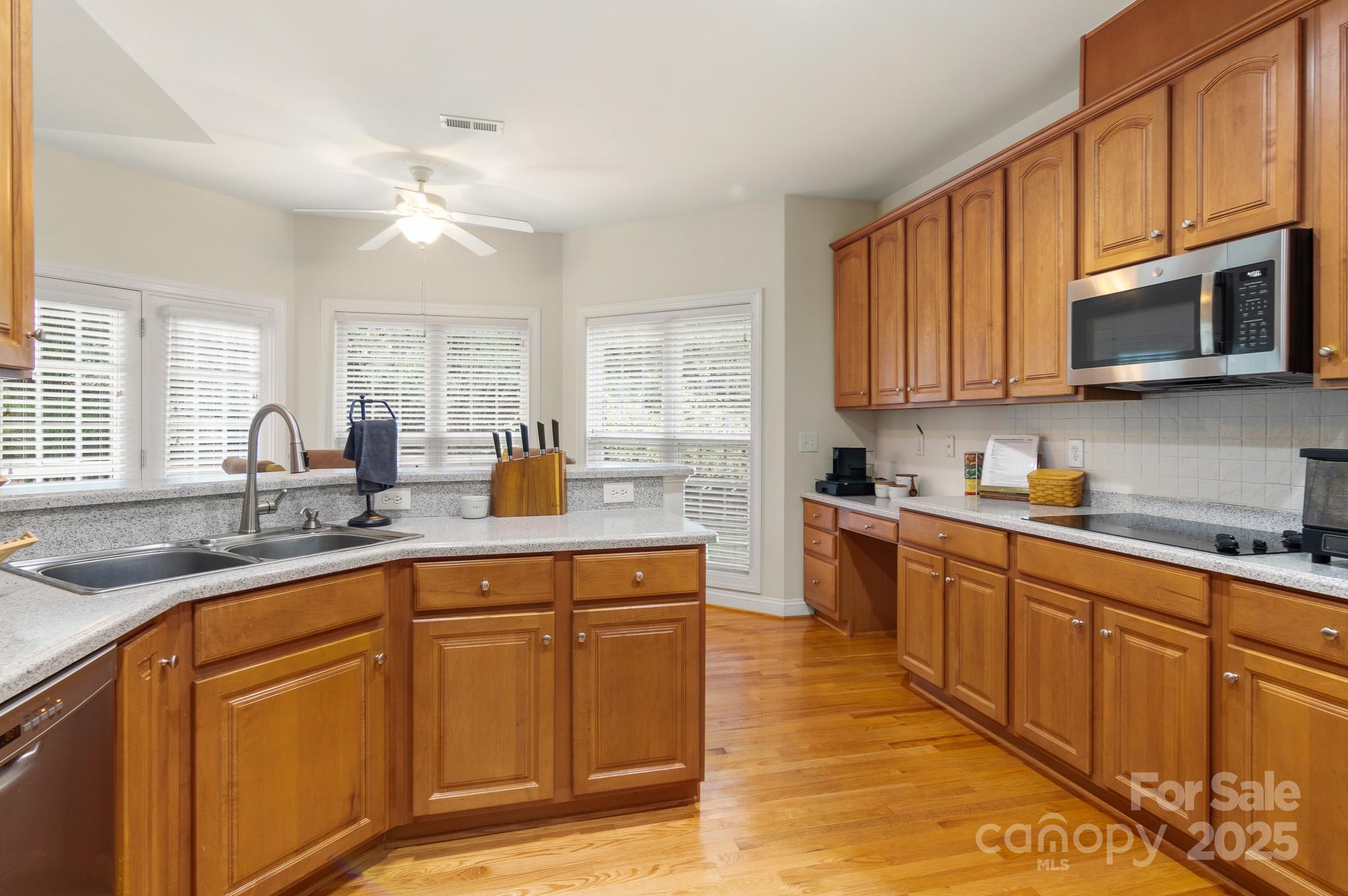 191 Melbourne Drive Fort Mill, SC 29708 - Photo 34 of 35 a kitchen with stainless steel appliances granite countertop a sink stove and microwave
