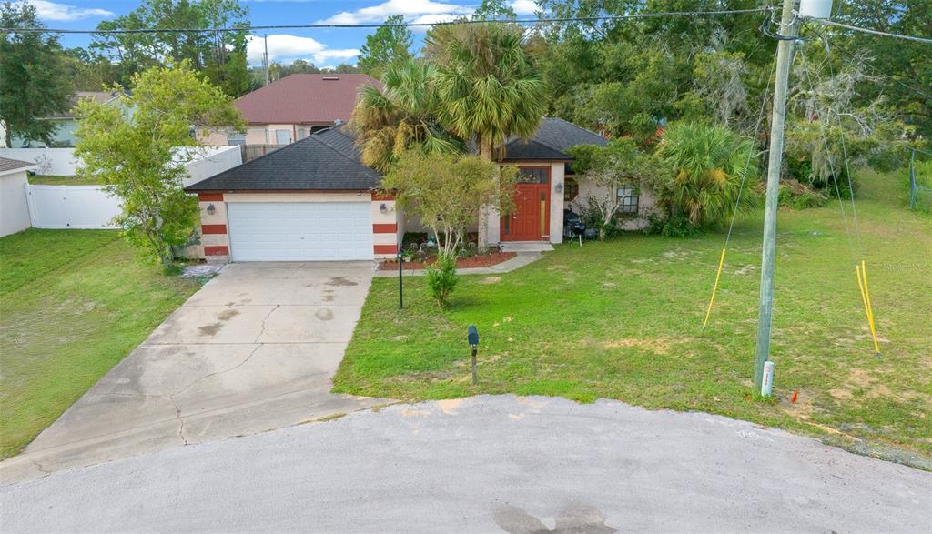 25 Cedar Terrace Ocala, FL 34472 - Photo 1 of 1 a front view of a house with garden
