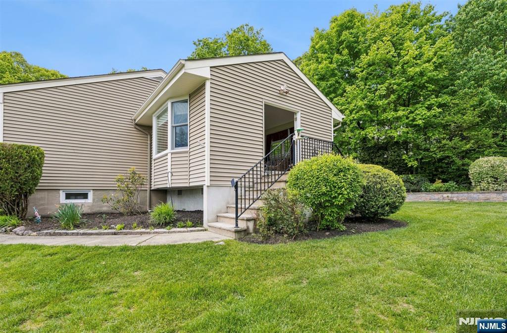 6 Waters Edge Butler, NJ 07405 - Photo 22 of 28 a view of a house with a backyard