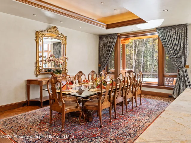 a living room with furniture a flat screen tv and a window