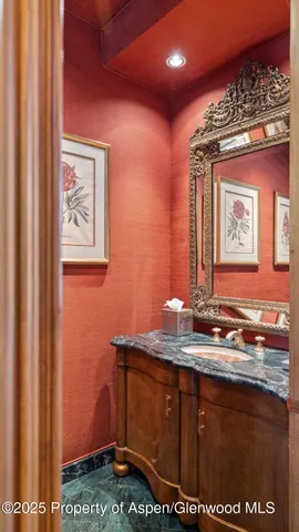 a bedroom with a bed and a fireplace