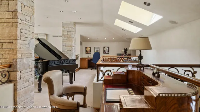 a room with water heater and wooden cabinets